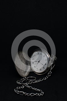 Front view of a pocketwatch on a black background