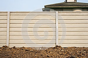 Front view of precast concrete Wall on fresh ground floor, prefabricated cement compound wall