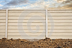 Front view of precast concrete Wall on fresh ground floor, prefabricated cement compound wall over cloudy sky