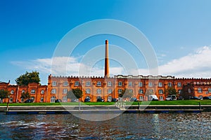 Front view on the red brick old ceramics factory on the Cojo Canal in Aveiro. Fabric of Jernymo Pereira Campos with tall chimney.