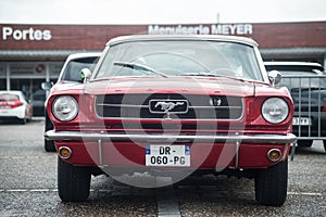 Front view of red Ford Mustang 1967 parked in the street