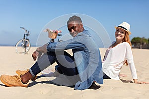 front view romantic mixed couple on beach