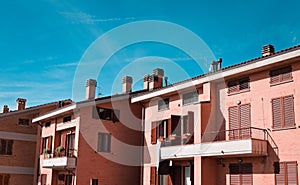 Front view of a series of apartments with chimneys on the roof Italy, Europe