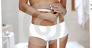 Front View Of Slender Woman Measuring Waist