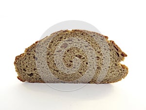 Front view of slice of artisan rye bread isolated on white background. Close-up of a piece of freshly baked artisan whole wheat