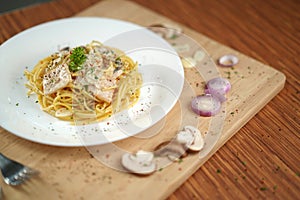 Front view of spaghetti carbonara on cutting board lunch dinner meal