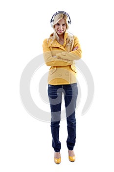 Front view of standing woman wearing headphone