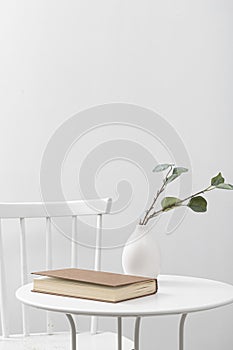 front view table with book vase. High quality beautiful photo concept