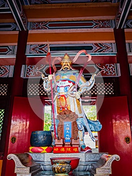 Front view of a Taoist deity, General Tian Peng, at a Taoist temple in Wen Bi Feng, Hainan, China