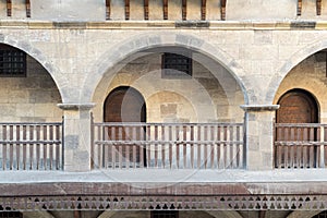 Front view of three arches with interleaved wooden balustrades photo