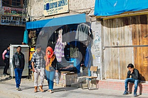 Front view of Tibetan shop clothes and souvenirs outside the tourist town of Leh, India.
