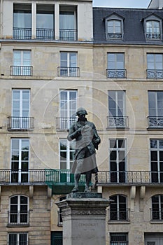 Front view to Le Marquis de Condorcet statue at Quai de Conti in Paris