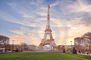 Front view of Tour Eiffel Paris iconic building at sunset