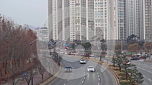 Front view traffic of modern cars on city road.