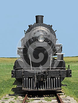 Front view train steam locomotive. photo