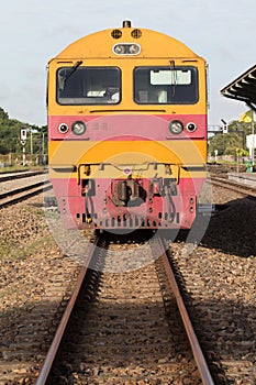 Front view of trains on railways track parking in railroads plat photo