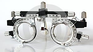 Front view of trial frame used in ophtalmology and optometry to diagnose and correct refractive errors.