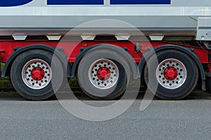 Front view on truck wheels and tires on truck chassis. Truck wheel rim