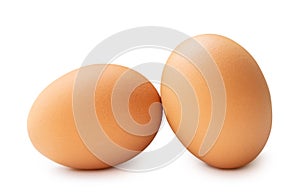 Front view of two brown chicken eggs isolated on white background with clipping path