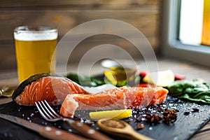 Front view of two pieces of raw salmon fillet preparing for cooking on cutting board. Good food