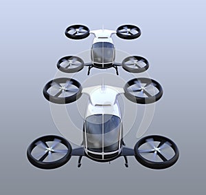 Front view of two self-driving passenger drones flying in the sky