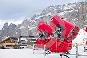 Front view of two snow cannons in alpine ski resort