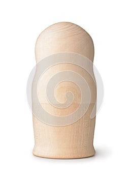 Front view of unpainted wooden matryoshka doll photo