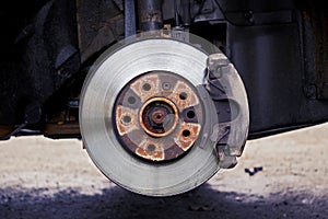 Front view of used car disc brake with caliper