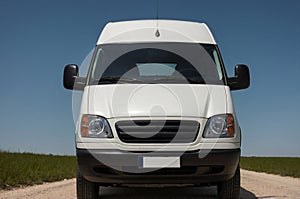 Front view of VAN, emphasizing the windshield, headlights, and front grille