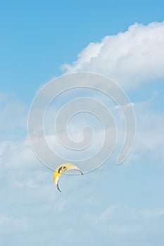 Orange canopy, filled with wind power, to propel a kite board photo