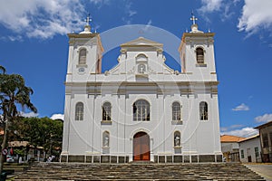 Front view of a white colonial church on a sunny day in historic town Sao Luiz do Paraitinga, Brazil
