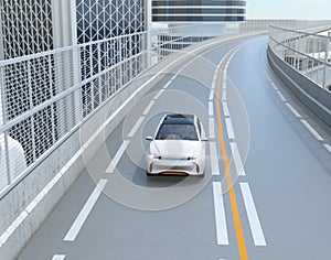 Front view of white electric SUV driving on the highway