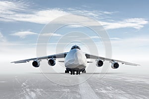 Front view of the white wide body transport cargo plane isolated on bright background with sky