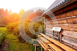 Front view of wooden house in russian village in sunny summer day