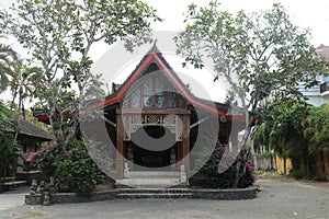 Front view of wooden small house in traditional Indonesian style with terrace. Lombok, Indonesia