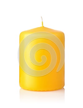 Front view of yellow unused wax candle