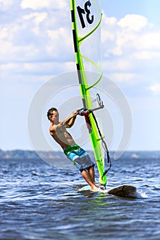 Front view of young windsurfer