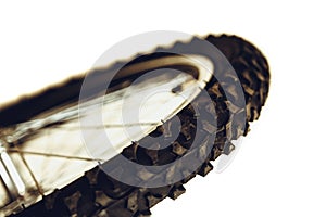 Front wheel of bicycle. Rubber bicycle tire close-up. Mountain bike. Wheel protector profile.
