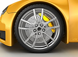 Front wheel of a bright yellow car