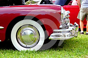 Front wheel of burgundy classic car