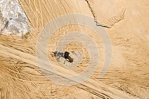 Front wheel loader on road construction site. aerial view