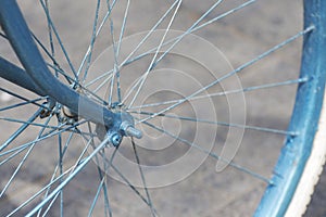 Front wheel of a retro bicycle. The spokes closeup