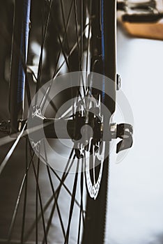 Front wheel of road bike isolated on dark background