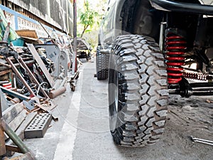 Front wheel and suspension of a car