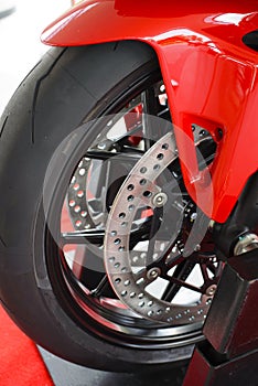 Front wheel and twin brake disc of racing motorcycle on a stands case