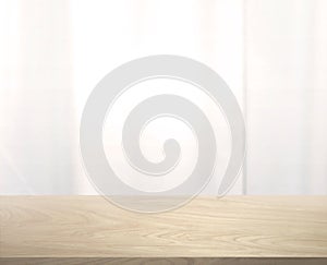 In front of a wooden table with a glass wall, blurry glass in the background For editing products or designing keys, layouts,