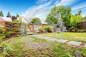 Front yard with wooden fence and gate