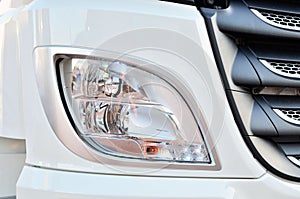 Frontal lighting products for on-highway vehicles, which includes integrated daytime running lights and beam patterns. Bi-Xenon