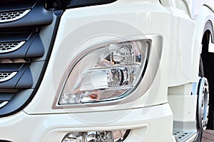 Frontal lighting products for on-highway vehicles, which includes integrated daytime running lights and beam patterns. Bi-Xenon