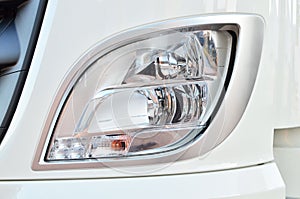 Frontal lighting products for on-highway vehicles, which includes integrated daytime running lights and beam patterns. Bi-Xenon